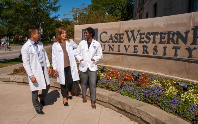 Prime students standing in front of the Case Western Reserve University sign